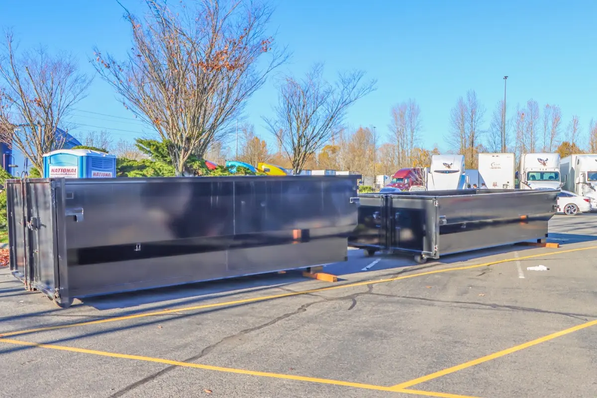 Professional dumpster rental service with roll-off container on residential driveway in Richardson